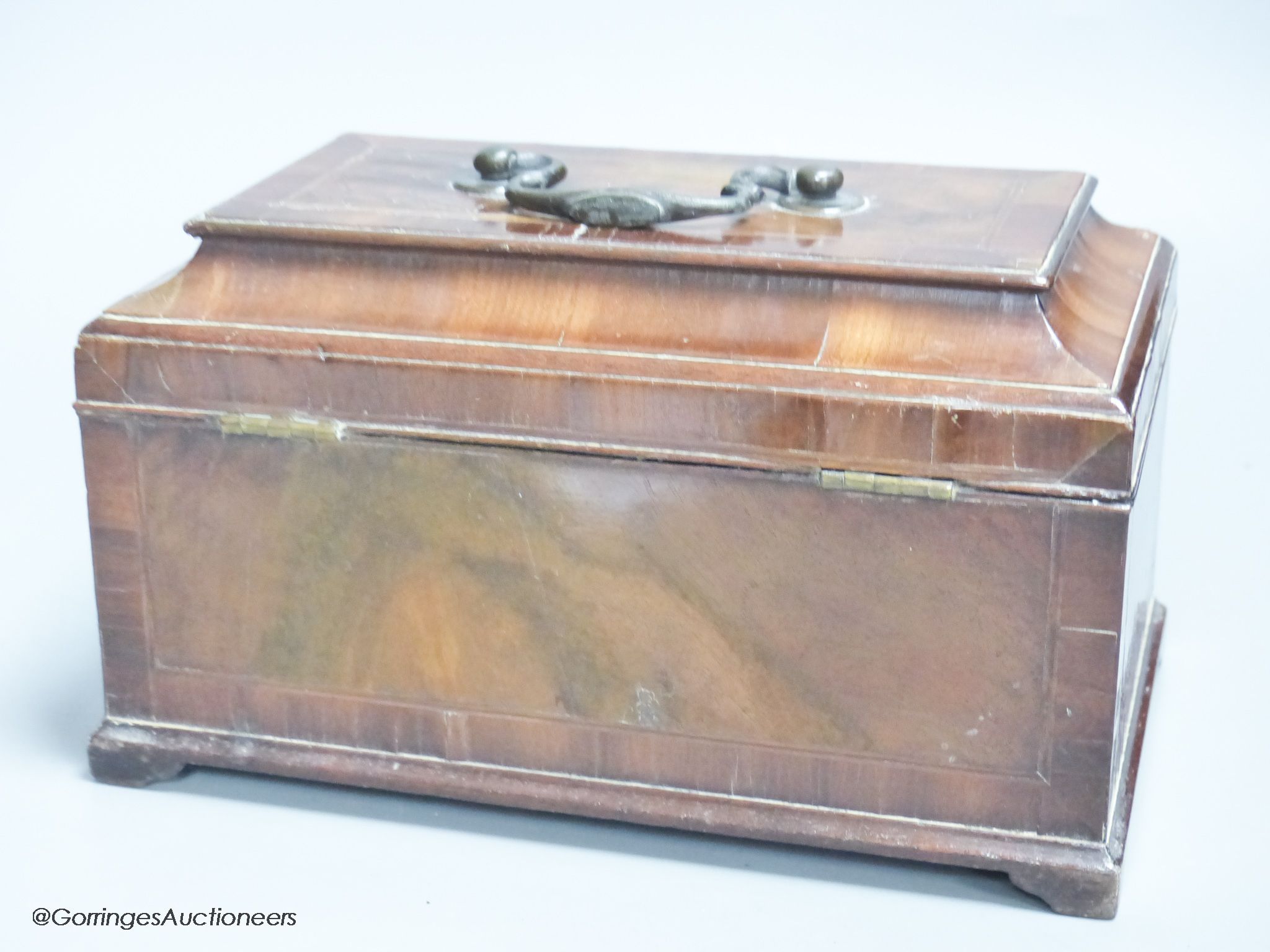 A late George II walnut line inlaid and cross banded tea caddy